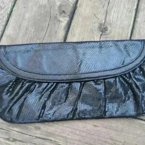 Vintage black faux snake skin clutch with purple  interior